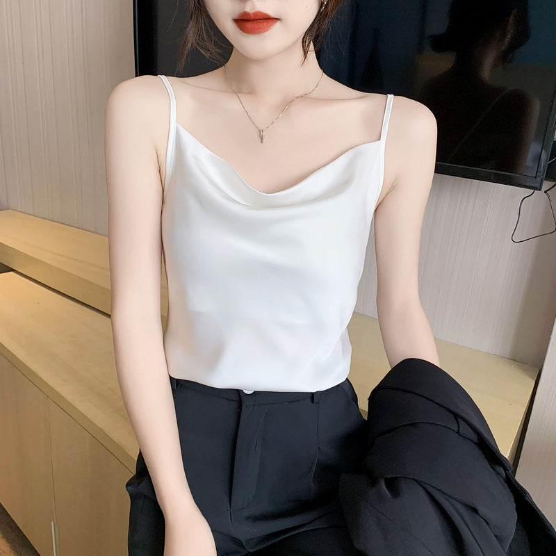 Real shot of a small camisole vest for women, with a suit inside, a white v-neck bottoming shirt.