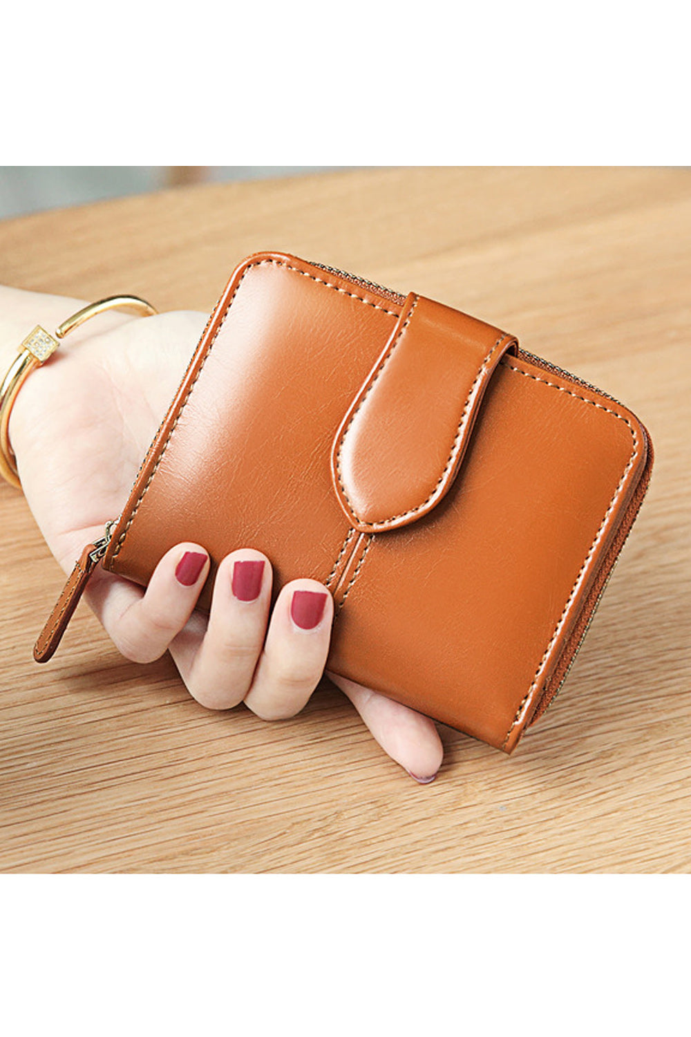 This women wallet is very cute and small in size. It has sections to keep cash and cards. Secured with zipper and flap button cl