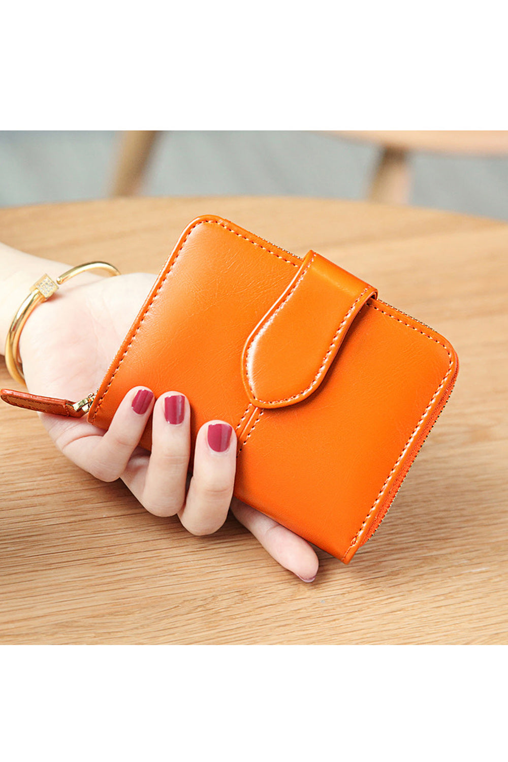 This women wallet is very cute and small in size. It has sections to keep cash and cards. Secured with zipper and flap button cl