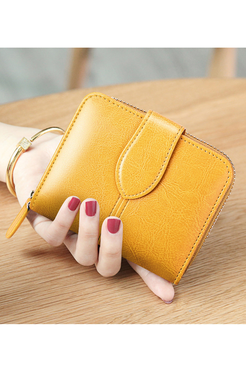 This women wallet is very cute and small in size. It has sections to keep cash and cards. Secured with zipper and flap button cl